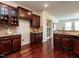The kitchen provides ample counter space and storage, overlooking a cozy living area at 1314 Cornell Pl, Raleigh, NC 27607
