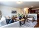 Comfortable living room with seamless access to the kitchen, perfect for entertaining at 1314 Cornell Pl, Raleigh, NC 27607