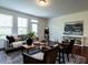 Inviting living room featuring hardwood floors, neutral paint, and plenty of natural light at 1314 Cornell Pl, Raleigh, NC 27607