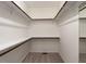 Walk-in closet with carpet and adjustable shelves provides ample storage space at 1314 Cornell Pl, Raleigh, NC 27607