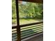 Screened porch with views of a serene yard at 1345 Ellis Rd, Durham, NC 27703