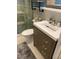 Bathroom featuring a modern vanity, tiled shower, and neutral color palette at 1345 Ellis Rd, Durham, NC 27703