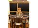 Cozy dining area featuring a wooden table, chairs, and place settings at 1345 Ellis Rd, Durham, NC 27703