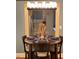 Dining room featuring a round table set for four with modern chandelier at 1345 Ellis Rd, Durham, NC 27703