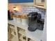 Modern kitchen featuring countertops, white subway tile backsplash, and stainless coffee maker at 1345 Ellis Rd, Durham, NC 27703