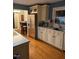 Well-lit kitchen with stainless steel appliances and hardwood floors at 1345 Ellis Rd, Durham, NC 27703