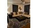 Spacious living room with a sectional sofa, decorative lighting, and a plush rug at 1345 Ellis Rd, Durham, NC 27703