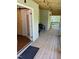 Inviting covered porch with wood flooring and outdoor seating area at 1345 Ellis Rd, Durham, NC 27703