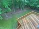 Enjoy lush backyard views from this spacious wooden deck at 150 Remington Ct, Youngsville, NC 27596