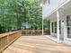 Expansive wooden deck overlooking a serene, wooded backyard at 150 Remington Ct, Youngsville, NC 27596