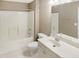 Functional bathroom featuring white vanity, and a shower-tub combination at 150 Remington Ct, Youngsville, NC 27596