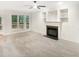 A view of the Living Room with fireplace and built in cabinets, with view to the outside Deck at 150 Remington Ct, Youngsville, NC 27596