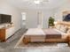 Serene main bedroom featuring a ceiling fan, ensuite bathroom, and walk-in closet at 150 Remington Ct, Youngsville, NC 27596
