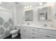 Hallway area with access to the laundry room with a full-size washer and dryer at 187 Ashley Woods Ct, Clayton, NC 27527