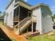 View of the back of the home featuring a screened-in porch and a staircase at 187 Ashley Woods Ct, Clayton, NC 27527