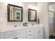 Bathroom with double vanity and framed mirrors, offering a clean and functional space at 187 Ashley Woods Ct, Clayton, NC 27527