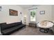 This bedroom offers versatile seating options and a serene view, ideal for relaxation or guest accommodations at 187 Ashley Woods Ct, Clayton, NC 27527