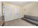 Neutral bedroom featuring a futon couch and closet space at 187 Ashley Woods Ct, Clayton, NC 27527