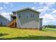 Exterior view of the back of the house with a deck and patio at 187 Ashley Woods Ct, Clayton, NC 27527