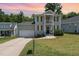 Charming two-story home with a gray exterior, black shutters, and a well-maintained front yard at 187 Ashley Woods Ct, Clayton, NC 27527
