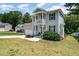 Attractive two-story home featuring a gray exterior with black shutters and an attached garage at 187 Ashley Woods Ct, Clayton, NC 27527