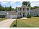 Charming two-story home with a gray exterior, black shutters, and a well-maintained front yard at 187 Ashley Woods Ct, Clayton, NC 27527