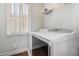 Convenient laundry room with a modern washer and dryer next to a window for natural light at 187 Ashley Woods Ct, Clayton, NC 27527