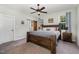 Spacious main bedroom boasts a king bed, ceiling fan, and natural light for a relaxing retreat at 187 Ashley Woods Ct, Clayton, NC 27527
