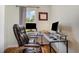 Home office setup with an ergonomic chair and natural light, creating a productive workspace at 187 Ashley Woods Ct, Clayton, NC 27527