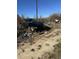View of wrecked vehicle and debris at 1916 E Hughes Mill Rd, Burlington, NC 27217
