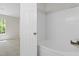 Relaxing bathroom with a soaking tub and natural light from a window at 20 Meadowcrest Dr, Durham, NC 27703