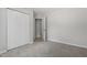 Bedroom featuring neutral carpeting, closet space, and ensuite at 20 Meadowcrest Dr, Durham, NC 27703