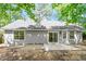 Rear exterior featuring a sliding glass door and patio area at 20 Meadowcrest Dr, Durham, NC 27703