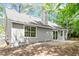 Rear exterior featuring a sliding glass door and patio area at 20 Meadowcrest Dr, Durham, NC 27703