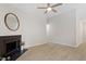 Bright living room with fireplace, modern ceiling fan, and neutral walls at 20 Meadowcrest Dr, Durham, NC 27703