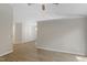 Open-concept living room featuring neutral walls and light wood-look floors at 20 Meadowcrest Dr, Durham, NC 27703