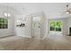 Open floor plan featuring living, kitchen, and dining spaces with hardwood floors and neutral colors at 20 Meadowcrest Dr, Durham, NC 27703