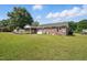 This beautiful red brick home features a spacious backyard and screened-in porch, perfect for outdoor entertaining at 203 Marlowe Dr, Dunn, NC 28334