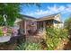 View of backyard brick patio, landscaping, fenced yard and enclosed porch at 203 Marlowe Dr, Dunn, NC 28334