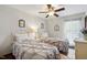 Bedroom featuring two beds, hardwood floors, ceiling fan and a window at 203 Marlowe Dr, Dunn, NC 28334