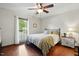 A cozy bedroom is enhanced by a large window and hardwood floors, providing great natural light at 203 Marlowe Dr, Dunn, NC 28334