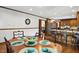Dining room with wood table, hardwood floors, and view into the kitchen at 203 Marlowe Dr, Dunn, NC 28334