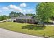 Spacious brick home on a lush corner lot with mature trees and manicured landscaping at 203 Marlowe Dr, Dunn, NC 28334