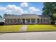 Charming brick home with a landscaped front yard and inviting front porch at 203 Marlowe Dr, Dunn, NC 28334