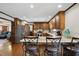 Eat-in kitchen with granite countertops, wood cabinets, stainless appliances and bar seating at 203 Marlowe Dr, Dunn, NC 28334