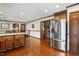 Open kitchen featuring an island with seating, stainless steel appliances, and hardwood floors at 203 Marlowe Dr, Dunn, NC 28334