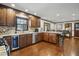 Updated kitchen featuring granite countertops, stainless appliances, wine cooler, and breakfast bar at 203 Marlowe Dr, Dunn, NC 28334