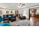 Open living room featuring hardwood floors, comfortable seating, and seamless flow at 203 Marlowe Dr, Dunn, NC 28334