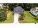 Aerial view of house, lawn, and mature trees at 204 Trevor Ridge Dr, Holly Springs, NC 27540