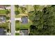 Aerial view of a home surrounded by mature trees and greenery at 204 Trevor Ridge Dr, Holly Springs, NC 27540